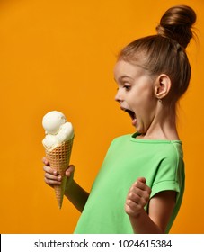 Pretty Baby Girl Kid Eating Licking Banana And Vanilla Ice Cream In Waffles Cone On Yellow Background With Free Text Copy Space