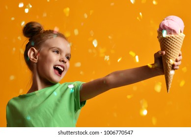 Pretty Baby Girl Kid Give Away Vanilla Ice Cream In Waffles Cone Laughing And Smiling On Yellow Background