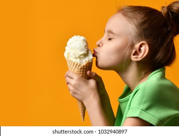 Pretty Baby Girl Kid Kiss Vanilla Ice Cream In Waffles Cone On Yellow Background And Show Thumbs Up Sign With Free Text Copy Space