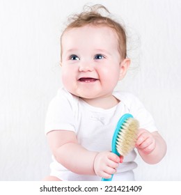 Pretty Baby Girl Playing With A Hair Brush