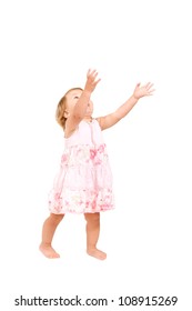 Pretty Baby Girl Standing And Holding Hands In The Air, Reaching For Something, Catching Something. Ready For Your Text Or Logo. Isolated On White Background With Clipping Path