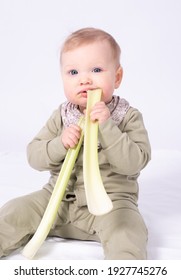 Pretty Baby Holds A Stem Of Celery, White Background