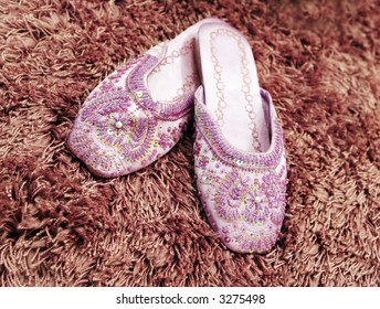 Pretty Beaded Slippers On Thick Wool Carpet