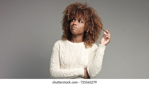 Pretty Black Girl With Big Hair Posing Video. Touching Hair And Thinking About
