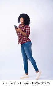Pretty Black Lady Feeling Excited While Using Her Phone, Full Length Portrait
