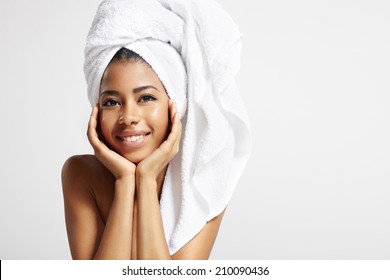 Pretty Black Woman With The Towel On A Head Is Smiling