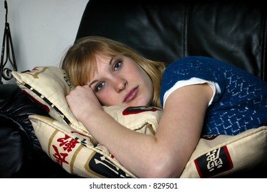 pretty blonde laying on sofa