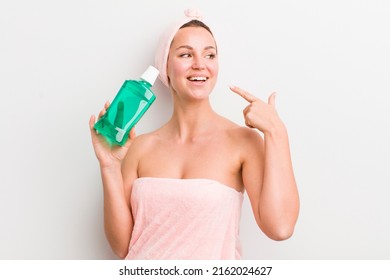 Pretty Blonde Woman With A Mouth Wash Bottle