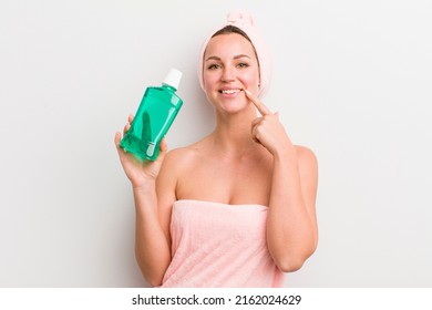 Pretty Blonde Woman With A Mouth Wash Bottle