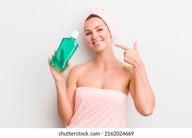 Pretty Blonde Woman With A Mouth Wash Bottle