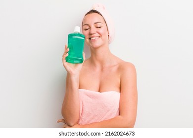 Pretty Blonde Woman With A Mouth Wash Bottle