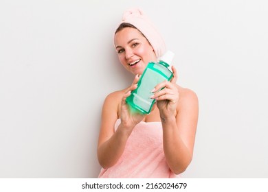 Pretty Blonde Woman With A Mouth Wash Bottle