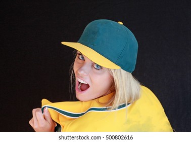 A pretty blonde woman ready to play some baseball or softball. - Powered by Shutterstock