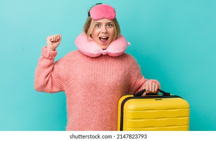 Pretty Blonde Woman Shouting Aggressively With An Angry Expression. Flight Passenger Concept