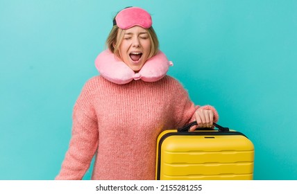 Pretty Blonde Woman Shouting Aggressively, Looking Very Angry. Flight Passenger Concept