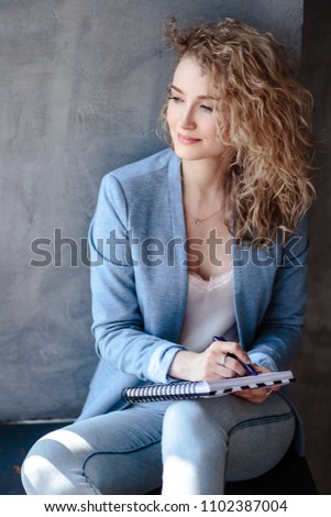 Similar – Künstlerin macht eine Pause und hält eine Tasse