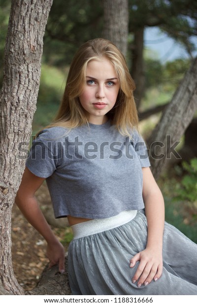Pretty Blondehaired Blueeyed Teenage Girl Sitting Stock Photo