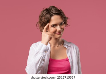 Pretty brainy woman with gesture - you, think about it. Looking camera on pink. Thinking positive. Intelligent person. High quality - Powered by Shutterstock