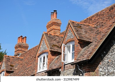 Pretty brick and flint cottages with dormer windows along a village street, Hambledon, Oxfordshire, England, UK, Western Europe.
