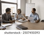 Pretty business lady explains key point related to agenda topics, marketing department sit at conference table discuss campaign budget, financial performance, planning strategy, review project details