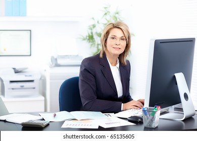 Pretty business woman working in the office