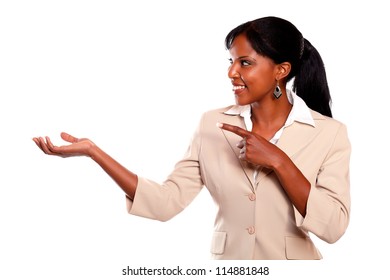 Pretty businesswoman looking and pointing right on isolated background