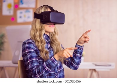 Pretty casual worker using oculus rift in her office