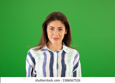 Pretty Caucasian girl on summer day smiling at camera greenscreen. Casual portrait of attractive woman in striped top posing on green screen - Powered by Shutterstock