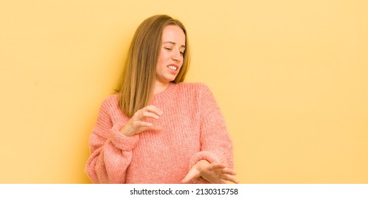 Pretty Caucasian Woman Feeling Disgusted And Nauseous, Backing Away From Something Nasty, Smelly Or Stinky, Saying Yuck