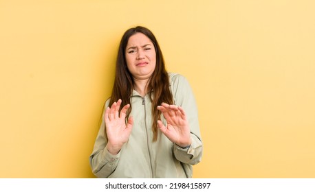 Pretty Caucasian Woman Feeling Disgusted And Nauseous, Backing Away From Something Nasty, Smelly Or Stinky, Saying Yuck