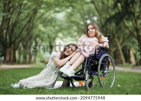 Similar – Daughter hugging senior mother in wheelchair