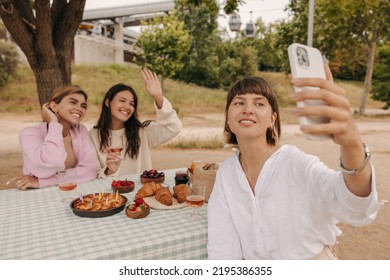 Pretty Caucasian Young Girls Smile Teeth Taking Selfie On Smartphone Spending Time Outdoors. Beauty Wear Casual Clothes In Spring. Happy Weekend Concept.