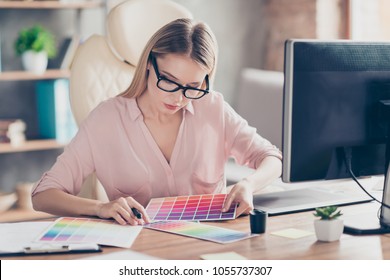 Pretty, Charming, Stylish Woman Working With Colour Chart, Sitting At Desk On Armchair In Workstation, Choosing Suitable Color For Her Sketch