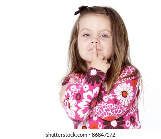 Pretty Child With Finger Over Lips Isolated On White Background