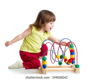 pretty child girl with color educational toy