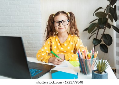 Pretty Child Girl Writing Notes In Notebook Daily Planner, Planning Week, Working Or Studying At Home