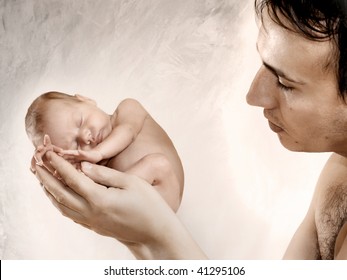 Pretty child is sleeping on the father's hand. Abstract background.