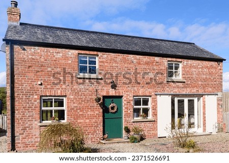 Pretty converted Irish barn house cottage with stable door and sliding barn doors.