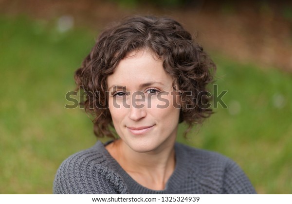 Pretty Curly Hair Woman Relaxing Smiling Stock Photo Edit Now