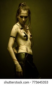 Pretty cyberpunk girl posing over dakr background