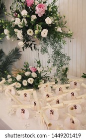 Pretty Decoration Of Celebration First Communion With Presents And Flowers In Restaurant