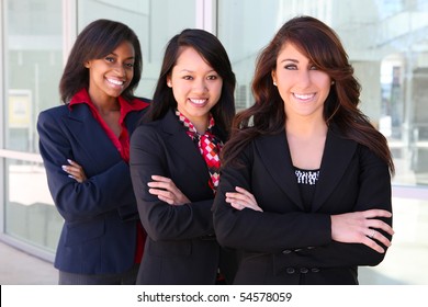 A pretty diverse young business woman team at office building