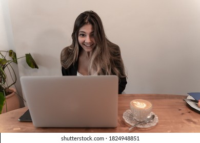 Pretty Elegant Businesswoman With Surprised Expression
On Video Call Or Virtual Meeting At Breakfast And Coffee Time