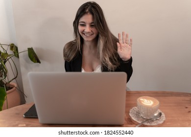 Pretty Elegant Businesswoman Waving While Smiling On Video Call Or Virtual Meeting At Breakfast And Coffee Time