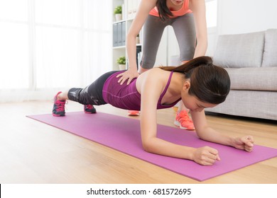 Pretty Elegant Fitness Woman Doing Workout Class At Home With Personal Trainer And Making Planking To Workout Body Muscle.