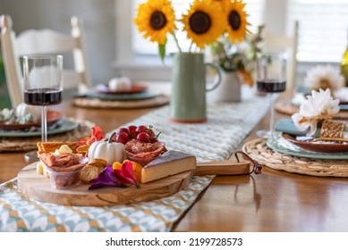 Pretty Fall Dining Table With Charcuterie Board In The Foreground