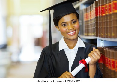 Pretty Female African College Graduate In Library