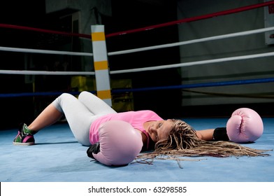 Pretty Female Boxer Knocked Out Laying On The Floor