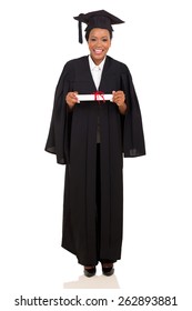 Pretty Female College Graduate In Gown And Cap On White Background