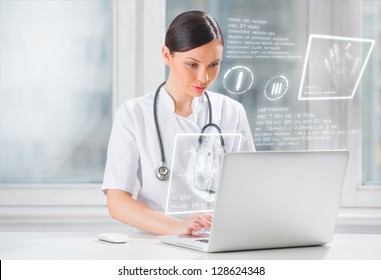 Pretty female medicine doctor working with modern computer interface - Powered by Shutterstock